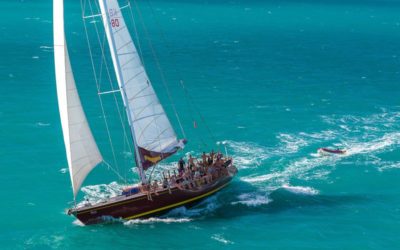 Condor Whitsundays overnight tour sailing with guests helping out